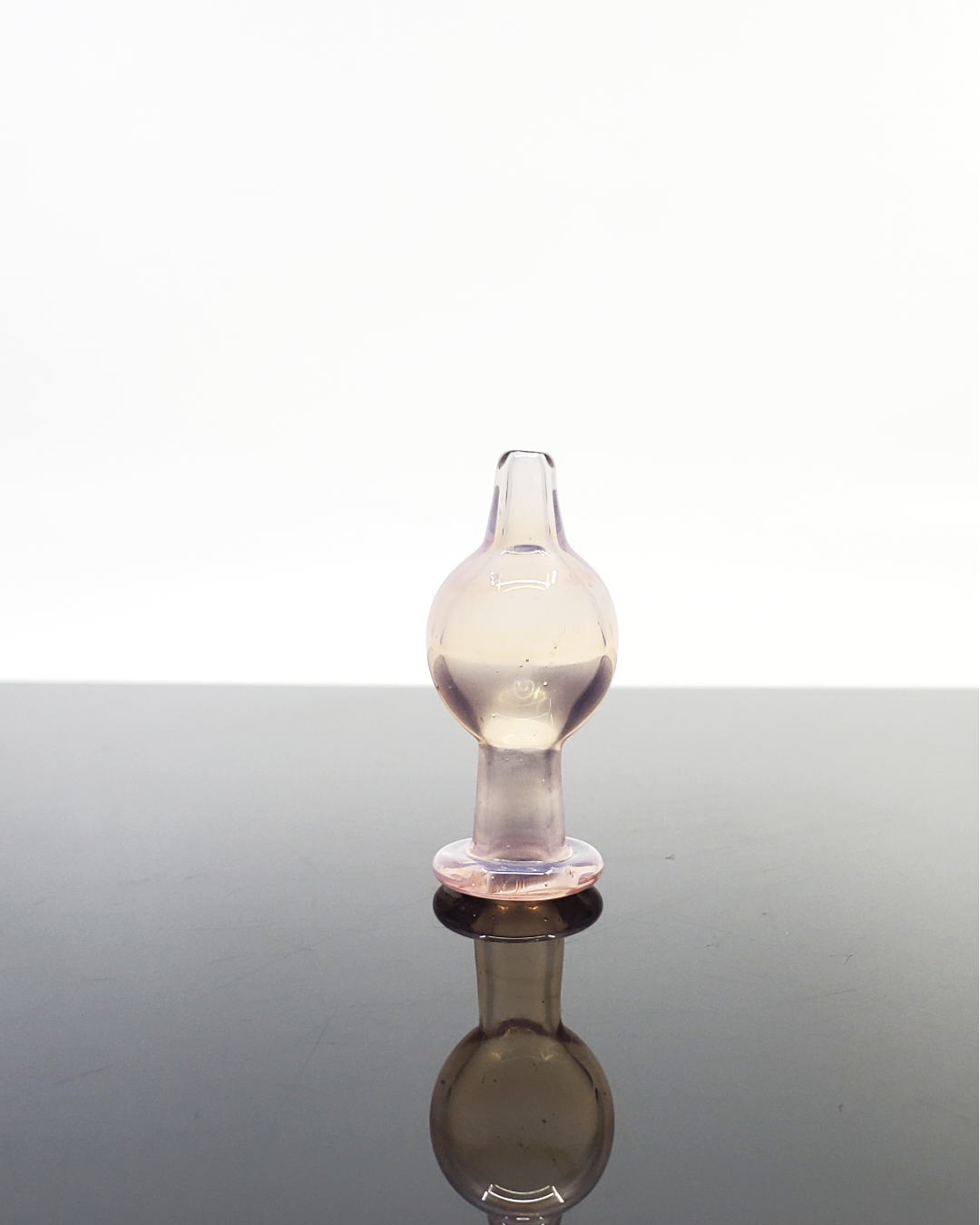 High-quality artisan glass bubble cap by Professor Dank, crafted for enhanced airflow and vaporization efficiency in dabbing sessions.