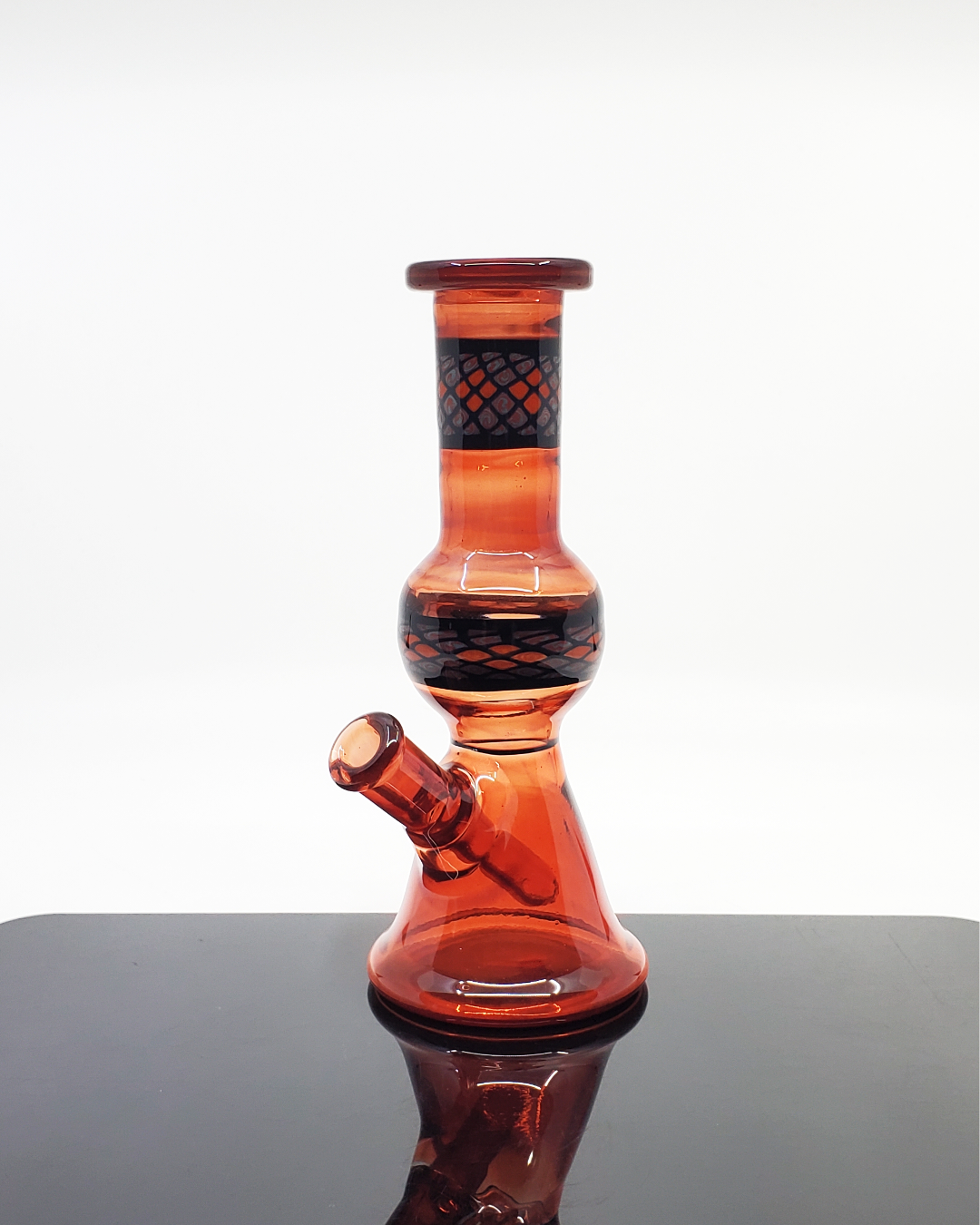 Blood Red Jammer 10mm Limited Edition: The Shipley Glass EXP Blood Red Jammer is a unique and eye-catching 10mm rig with a deep red hue, a limited edition piece perfect for heady glass collectors who appreciate both style and function.