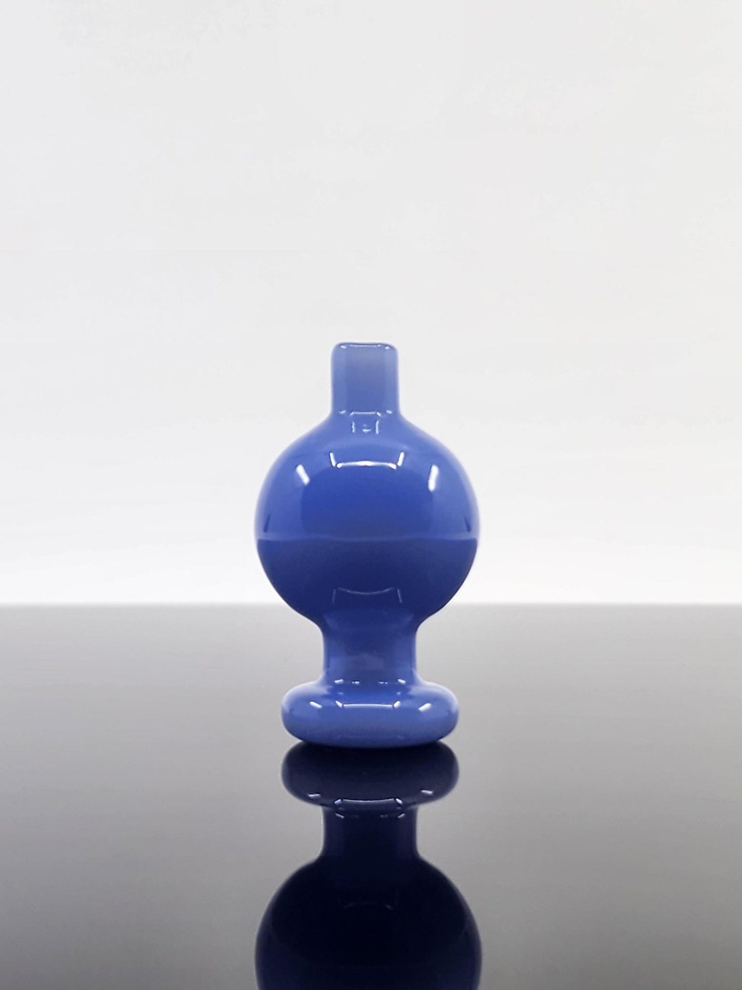 Detailed view of the BSG Full Color Bubble Cap, emphasizing its colorful finish and precision-crafted design for smooth, flavorful vapor.