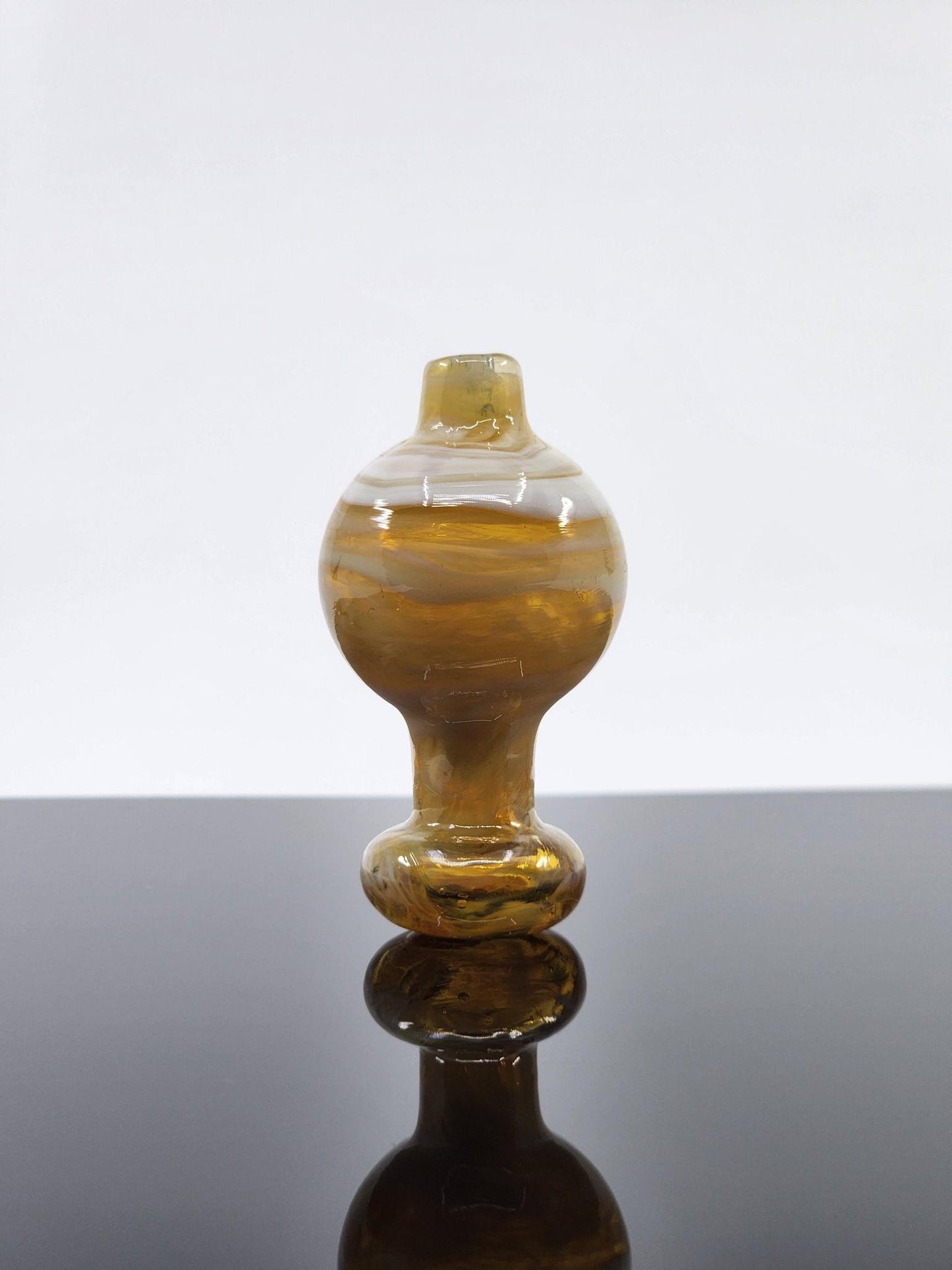 BSG Milky Bubble Cap placed on a 25mm quartz banger, enhancing vapor flow and providing smooth, flavorful hits during dabbing sessions.