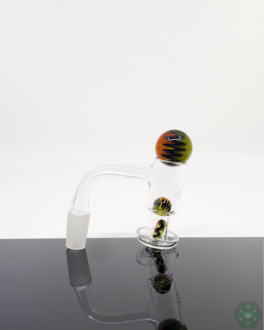 Close-up of the Ditton Glass Wigwag Slurper Set, showcasing intricate color patterns and airflow optimization.