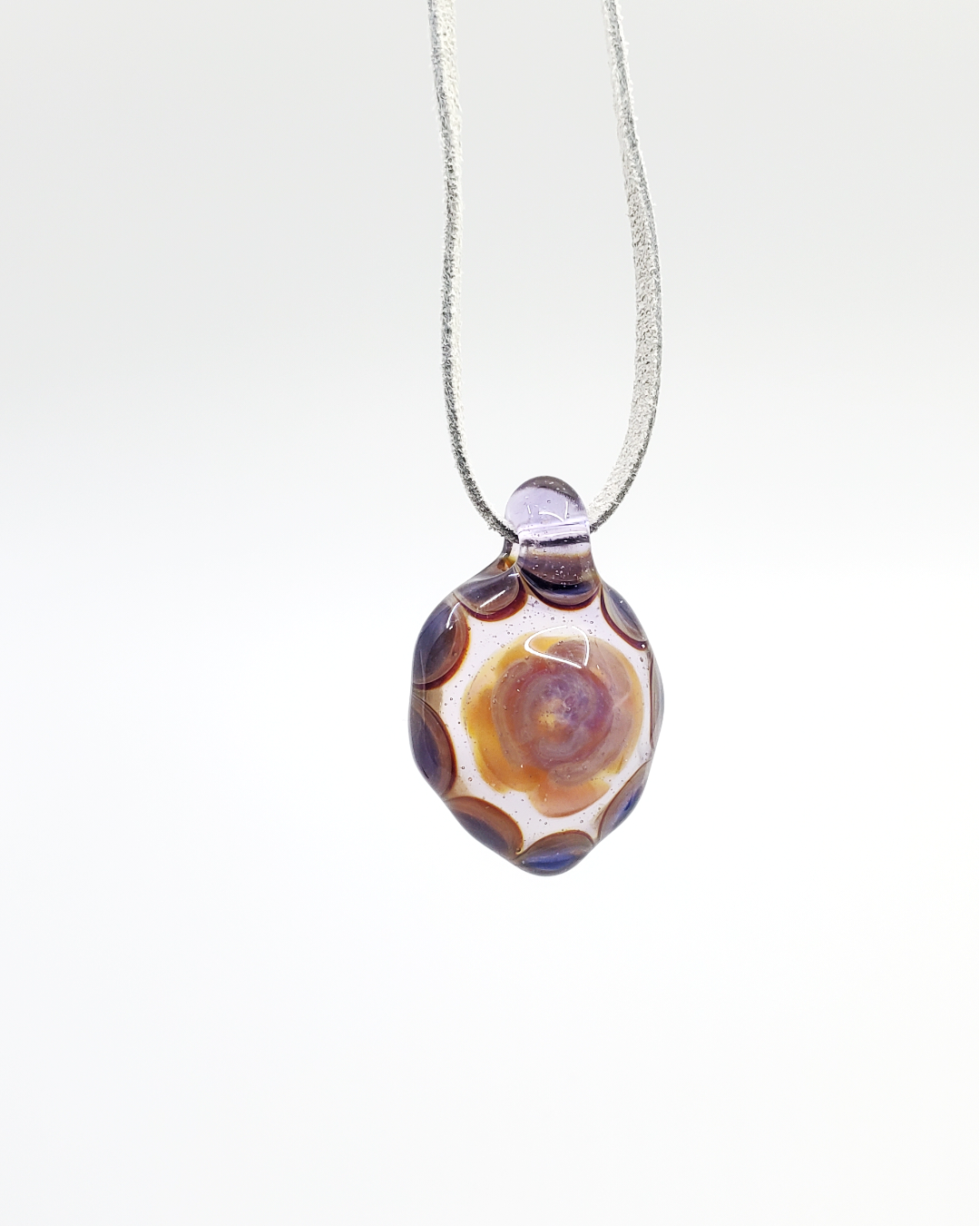Fumed Glass Pendant showcasing a stunning color shift and high-quality craftsmanship, adding elegance and uniqueness to any jewelry collection.