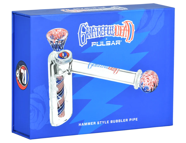 Grateful Dead x Pulsar Wig Wag Hammer Bubbler – 4-inch glass bubbler with Stealie herb slide and etched dancing skeleton. Includes luxury padded box and is perfect for collectors and fans of Grateful Dead memorabilia.