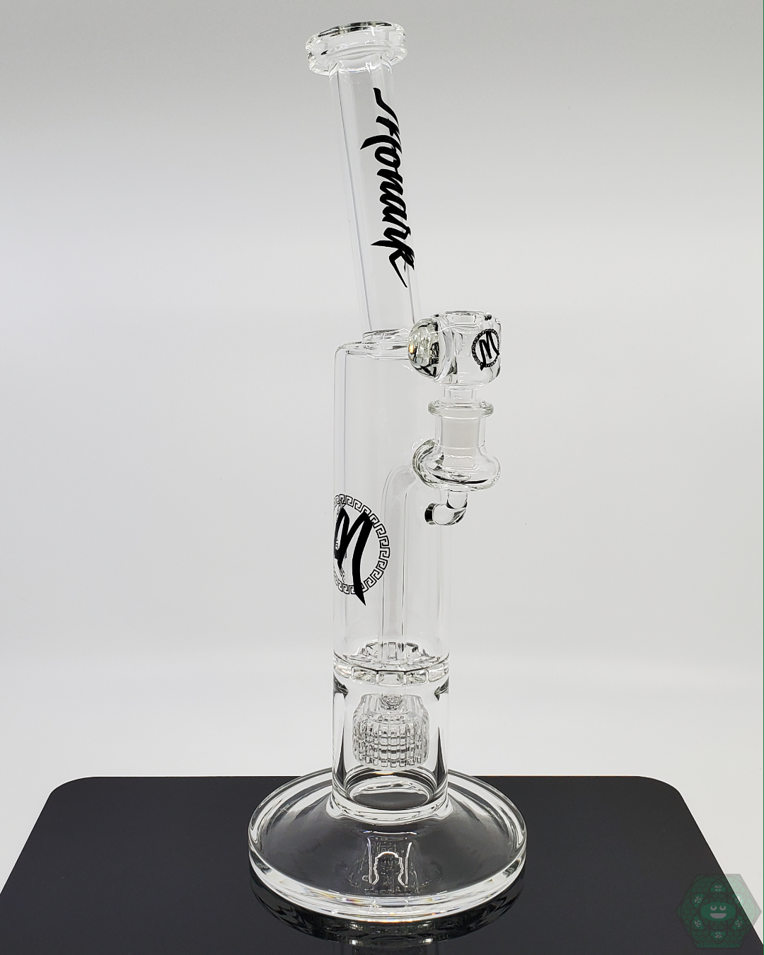 Close-up of the Monark Glass 50MM Clear Ratchet, showcasing its intricate design and superior filtration system for clean, smooth hits.