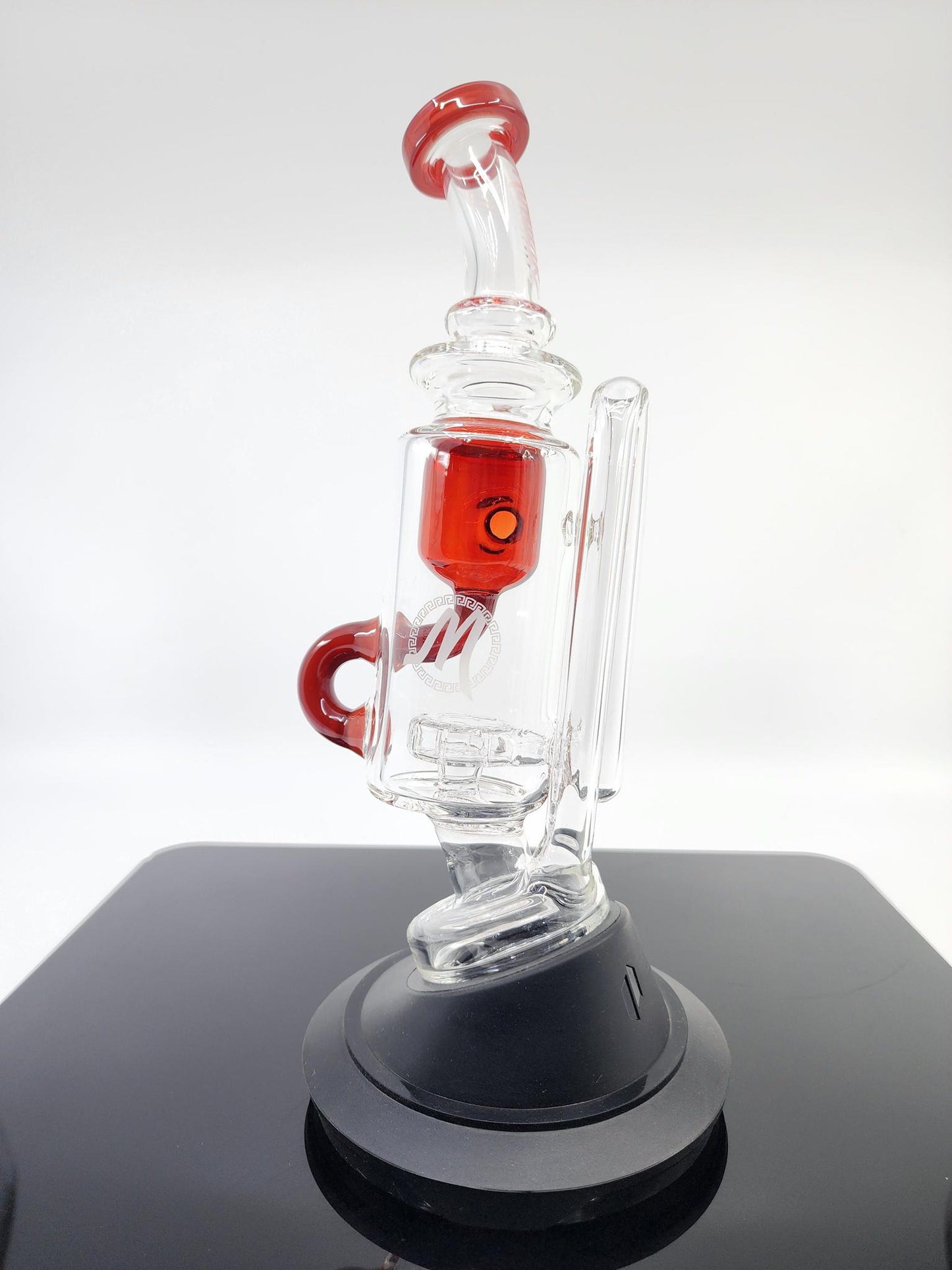 Side view of the Monark Glass Recycler Attachment, showcasing its efficient design for improved filtration and smoother hits.