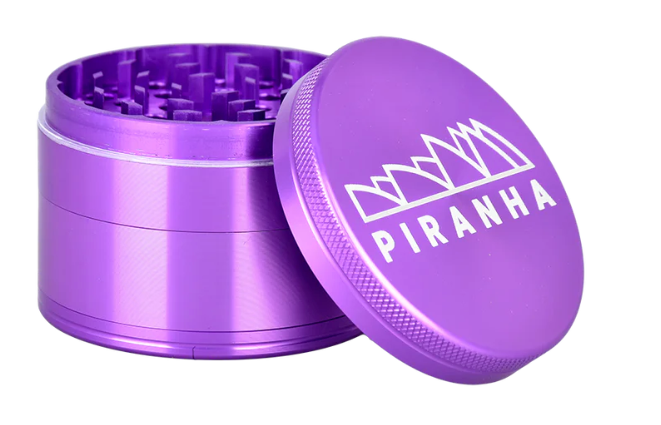 Piranha 2.5" 4-Piece Herb Grinder, with magnetic closure, storage compartment, and sifting screen for efficient and easy use.