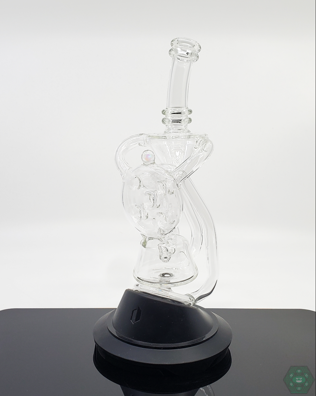 Close-up of the Swiss Recycler's durable glass and artistic design, perfect for elevating the user's vapor experience.