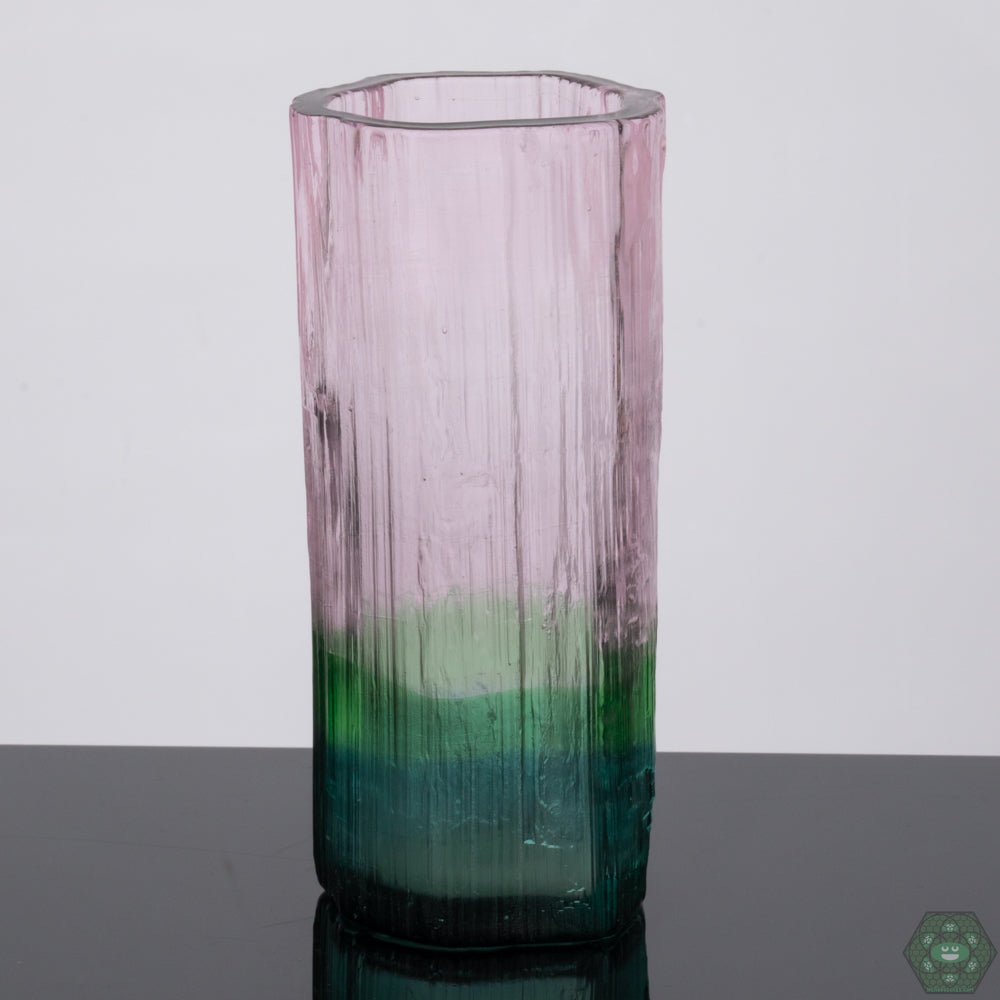 Artistic Drinking Glass: This handcrafted tall glass from Digger Glass is not only functional but also a beautiful piece of art, serving as a centerpiece for your table and adding a touch of elegance to any setting.