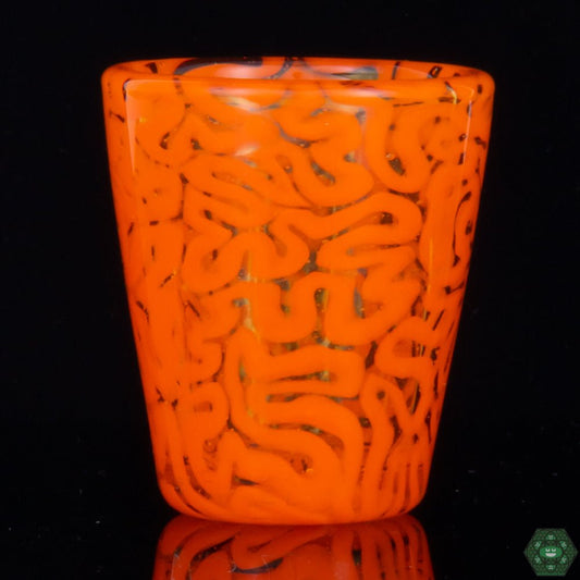 Handcrafted Art Glass Shot Glass: This Orange Brain Tech Shot Glass by Algae Glass is a unique and collectible piece of art glass, featuring intricate brain patterns and vibrant colors, perfect for adding a touch of artistic flair to your collection.
