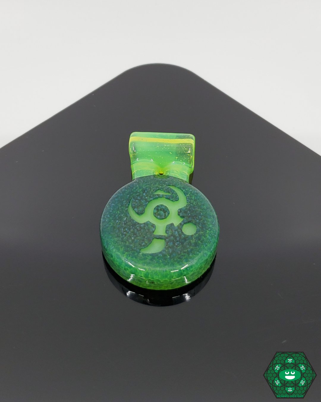 IO Glass Pendant, a handcrafted artistic jewelry piece by IOglass featuring intricate details and a unique glass design.