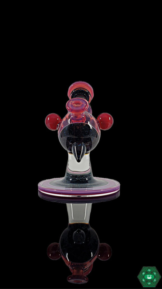 Telemagenta Crushed Opal Heliosphere: The Cajun Glass Telemagenta Heliosphere showcases crushed opal accents and UV-reactive glass in a striking design, perfect for collectors and featuring a versatile 10mm female joint.