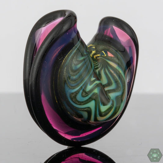 Wig-Wag Glass Pendant with Opal and UV: This eye-catching pendant showcases a vibrant wig-wag pattern, complemented by crushed opal and UV accents for a stunning visual effect, making it a unique and playful accessory.