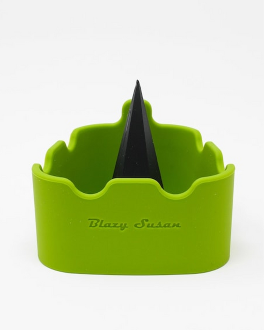 Blazy Susan - Premium Silicone Deluxe Ashtray + Debowler. This flexible, mess-free ashtray and bowl cleaner is perfect for ashing out clogged-up bowls. It features a built-in spike for extra clearing action and comes in an assortment of colors.