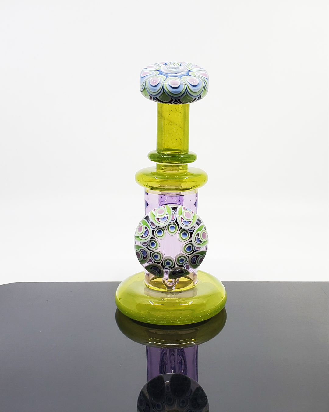 Dotstack Jammer with Cabbed Mouthpiece: The RL Dots Dotstack Jammer features a unique cabbed mouthpiece and an intricate dotstack pattern, creating a functional and visually appealing 14mm dab rig.