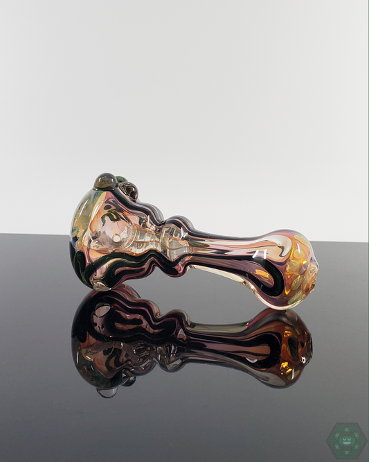 Side view of the LQL Glass Fumed Linework Spoon, showcasing its detailed fumed glass patterns and smooth contours.