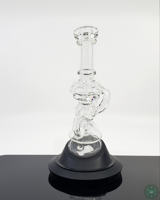 Using the Mini Recycler attachment on a Puffco, showing its effective water filtration in a compact form.