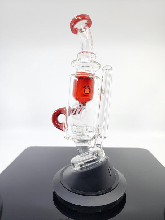  Side view of the Monark Glass Recycler Attachment, showcasing its efficient design for improved filtration and smoother hits.
