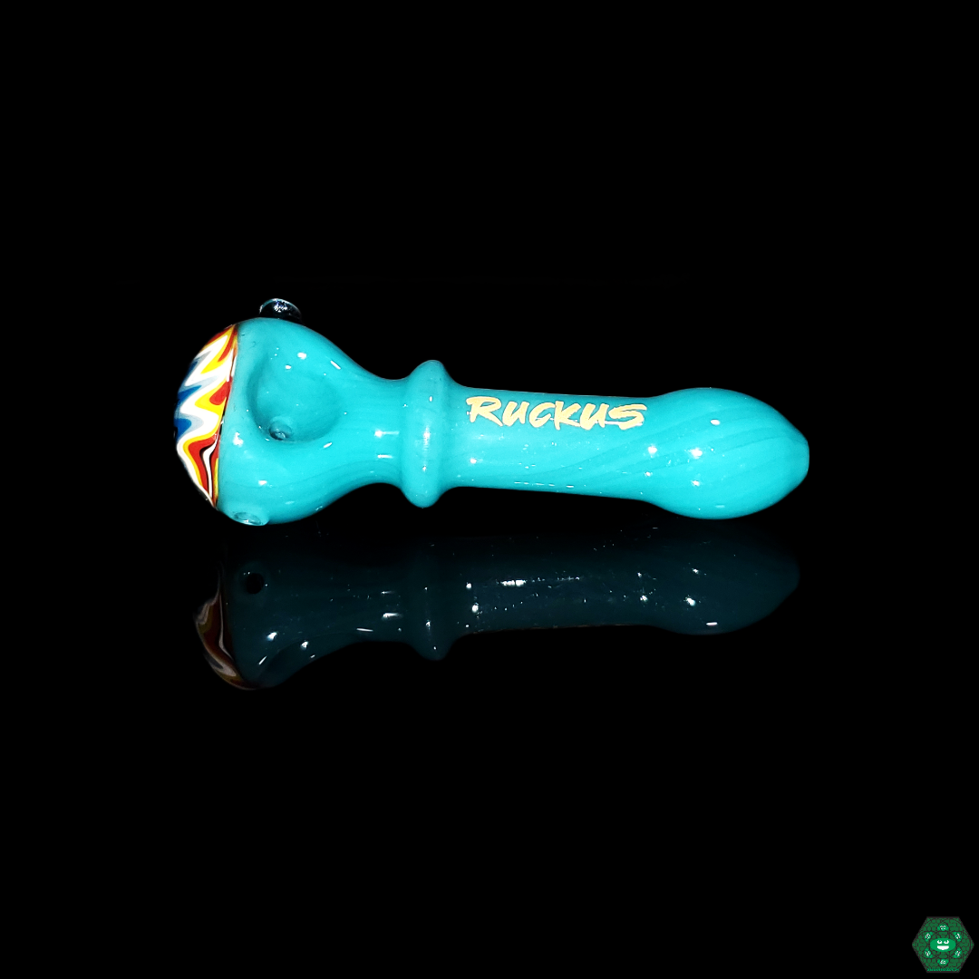  Artistic view of the Ruckus Glass Wigwag Spoon, emphasizing the vibrant swirling patterns and high-quality glass craftsmanship