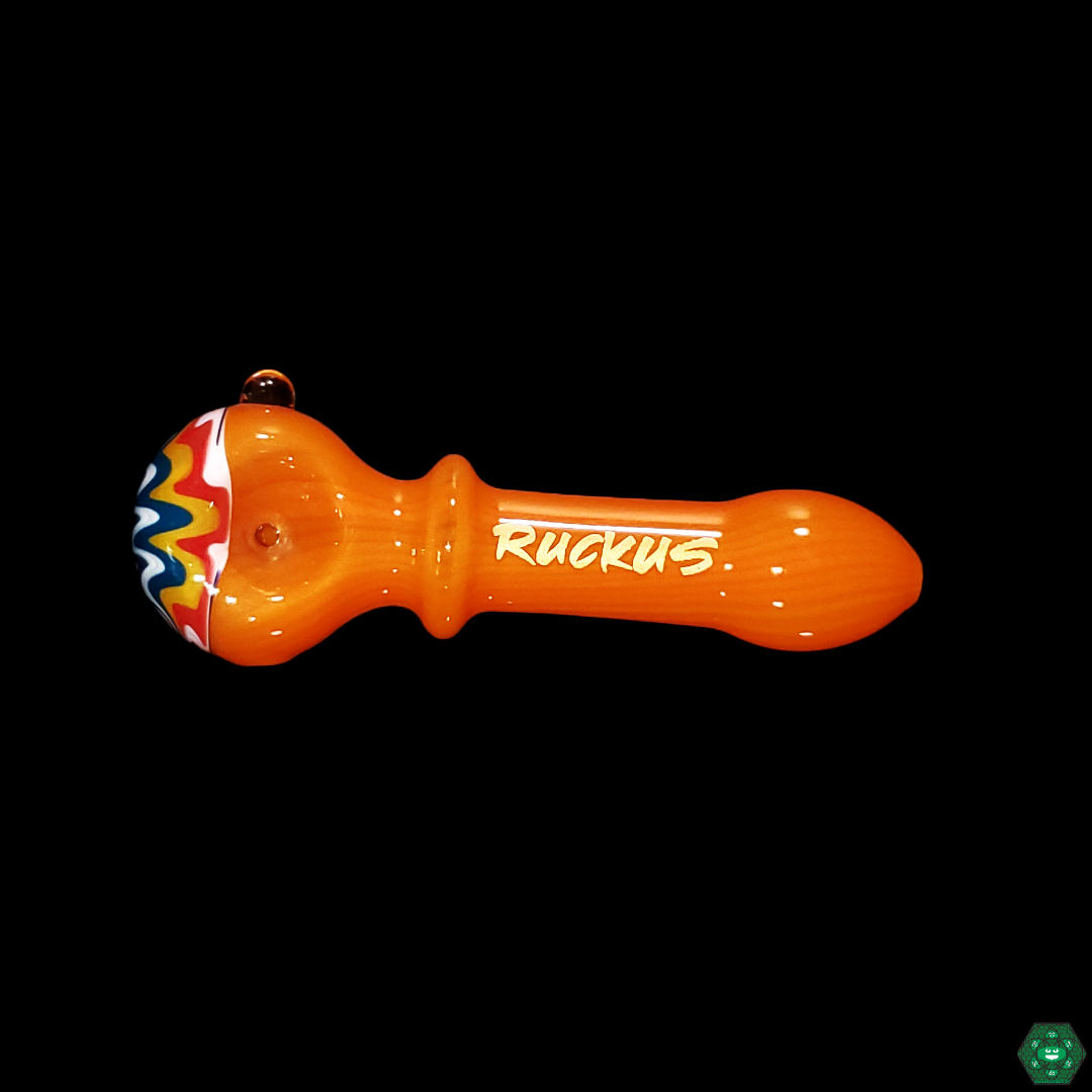 Close-up of the Ruckus Glass Wigwag Spoon’s vibrant color palette, showcasing the vivid, swirling patterns that make it a visually striking piece.